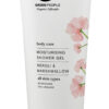 A close-up photo of the Green People Moisturising Shower Gel tube in a simple, elegant style with pink flowers.